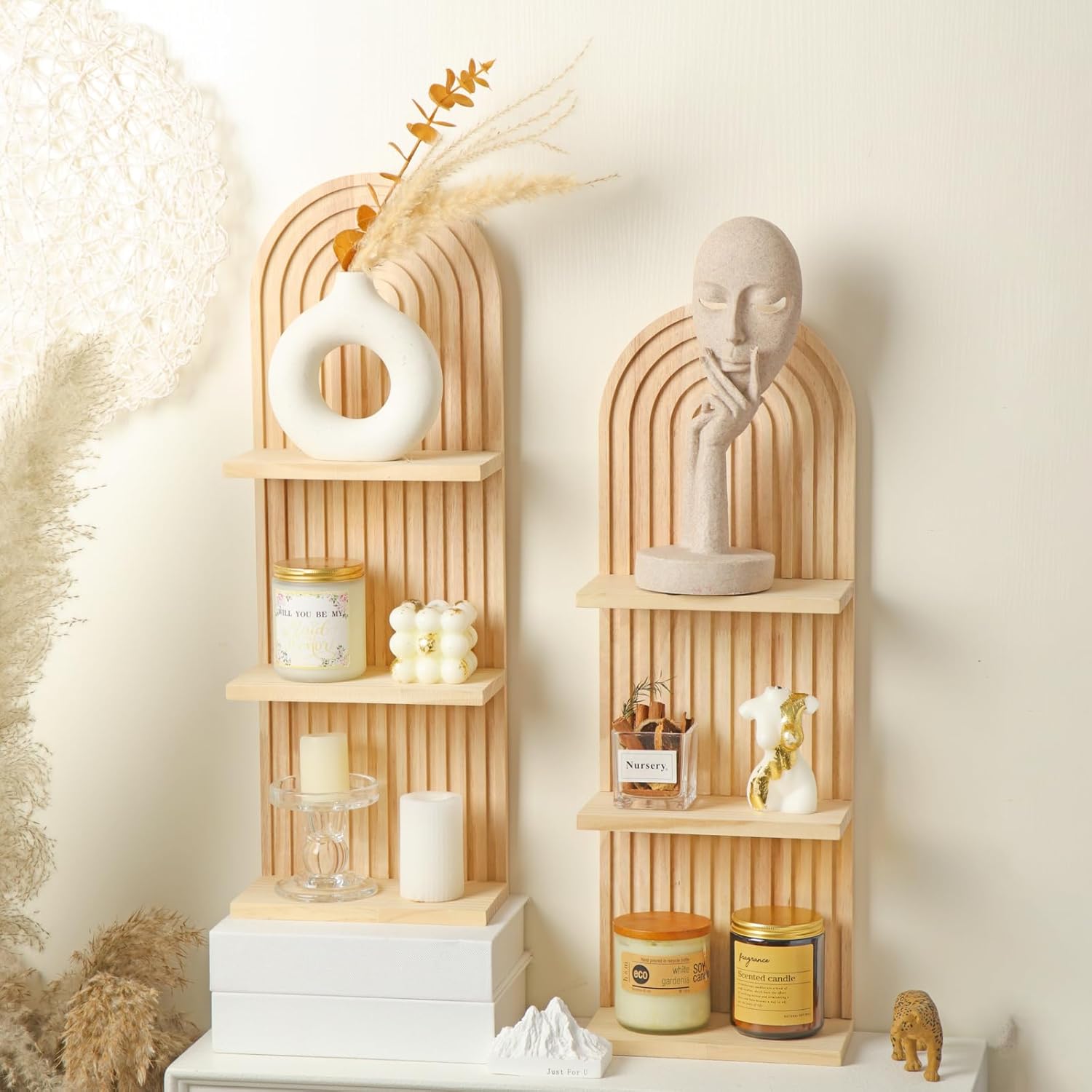 Two carved and arched shelves