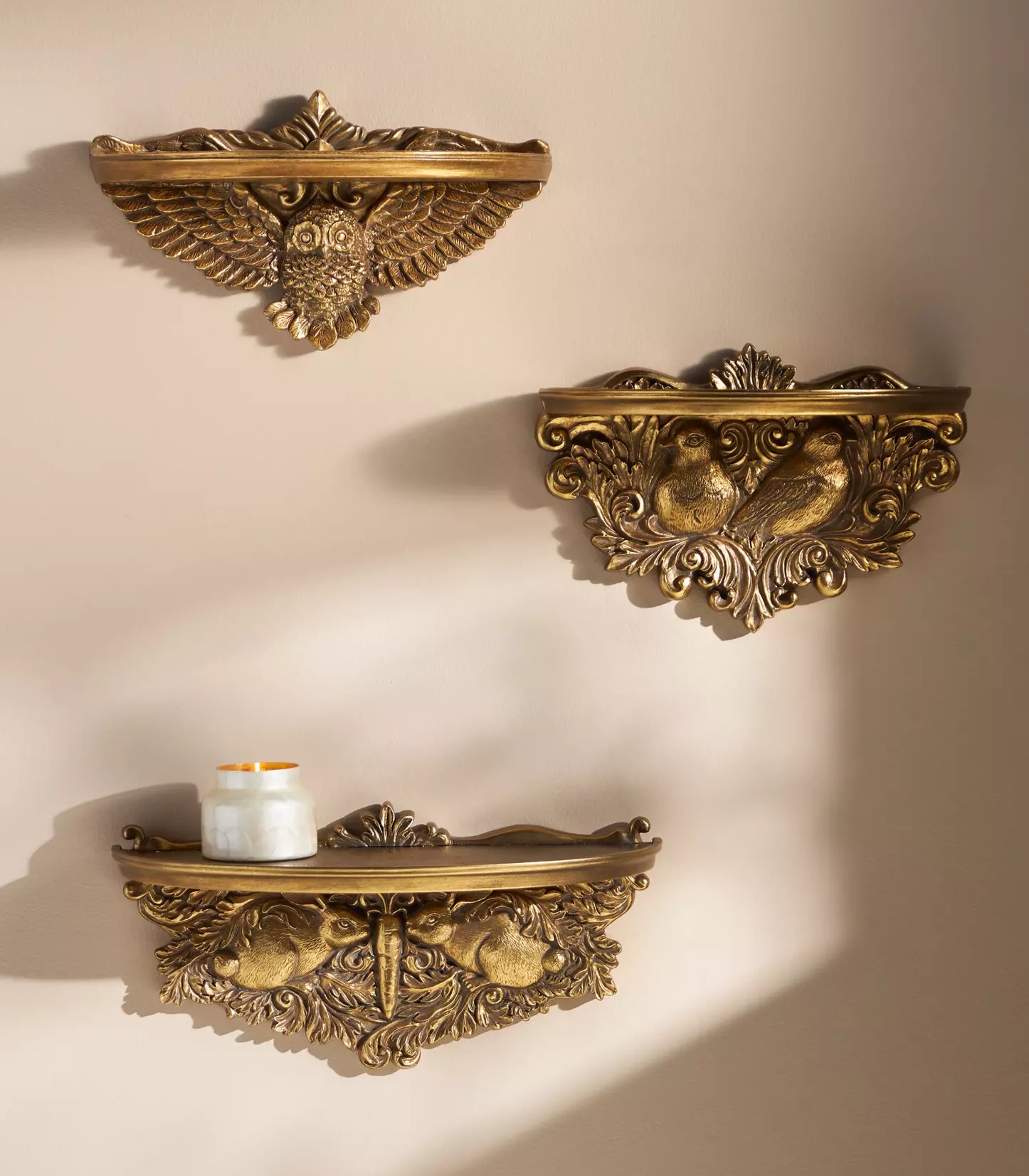 Ornate brass shelves with animal motifs