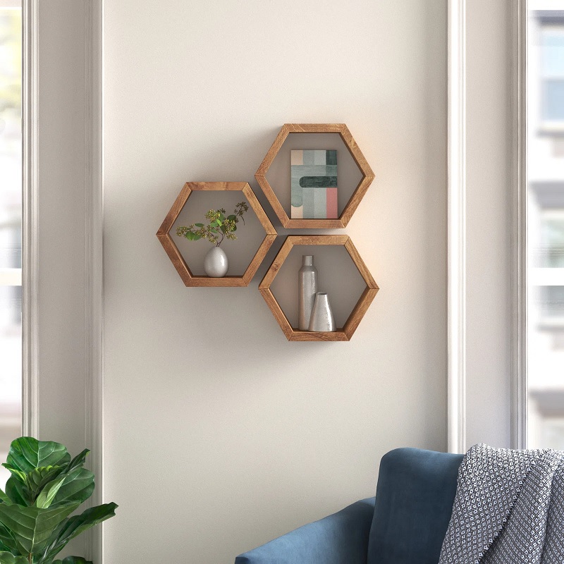 Three wooden hexagon-shaped shelves