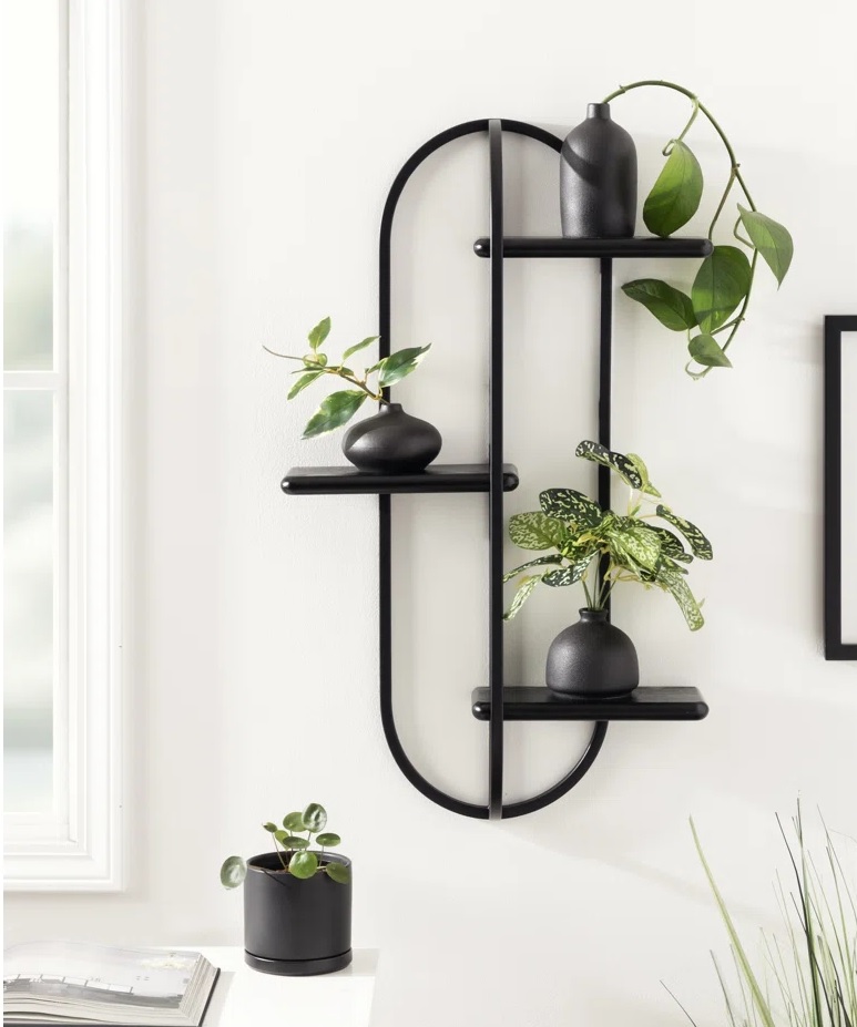 Black oval shelf with three tiers