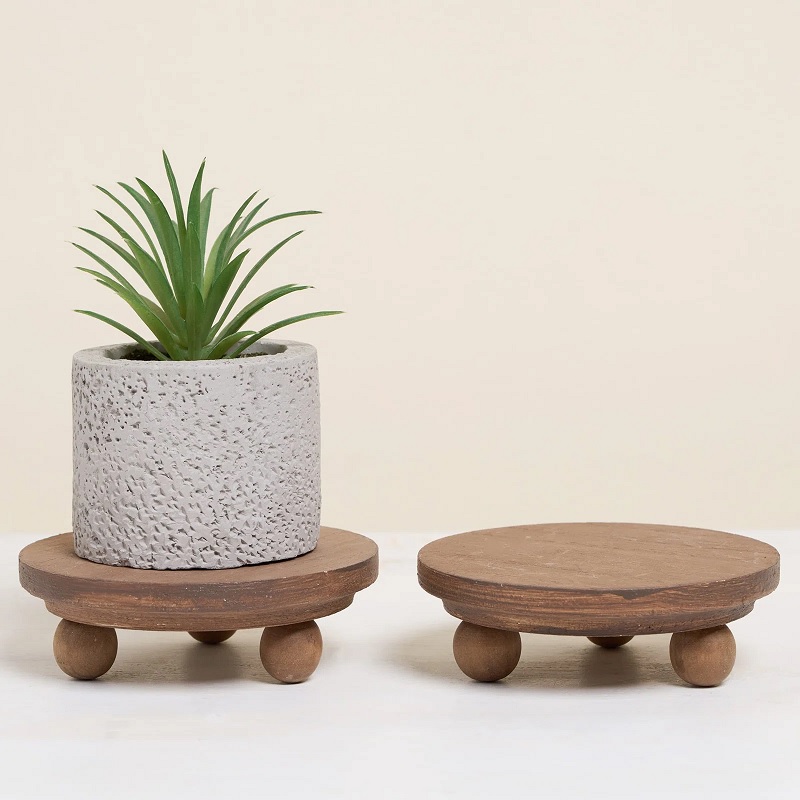 Miniature wooden plant stands with round feet