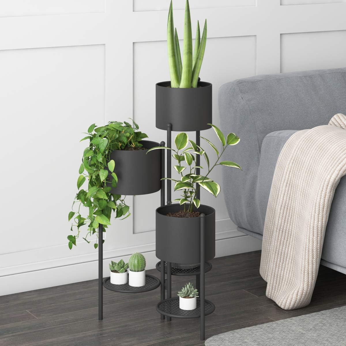 Black plant stand with three planters and three shelves