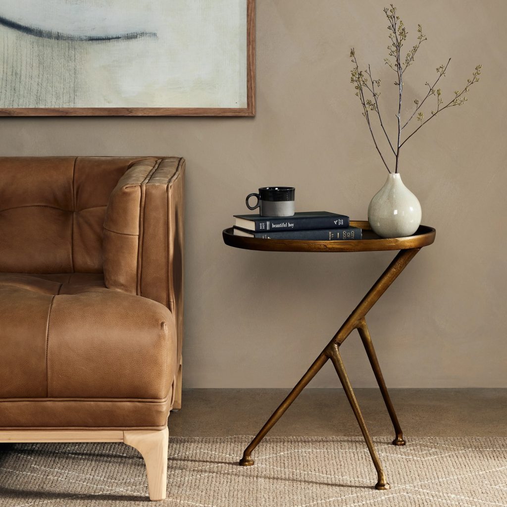 Three-legged brass end table