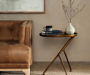 Three-legged brass end table