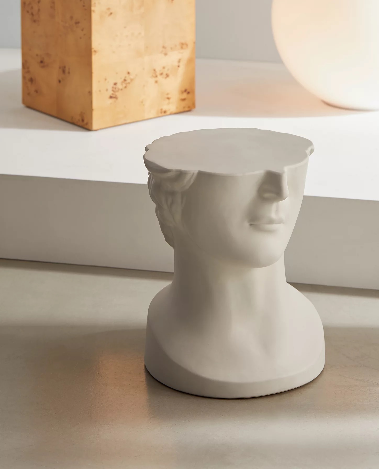 End table shaped like a bust statue