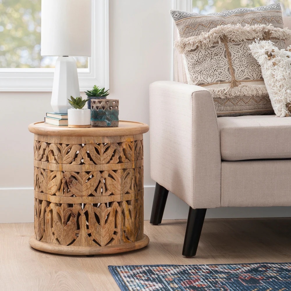 Intricately carved wood end table