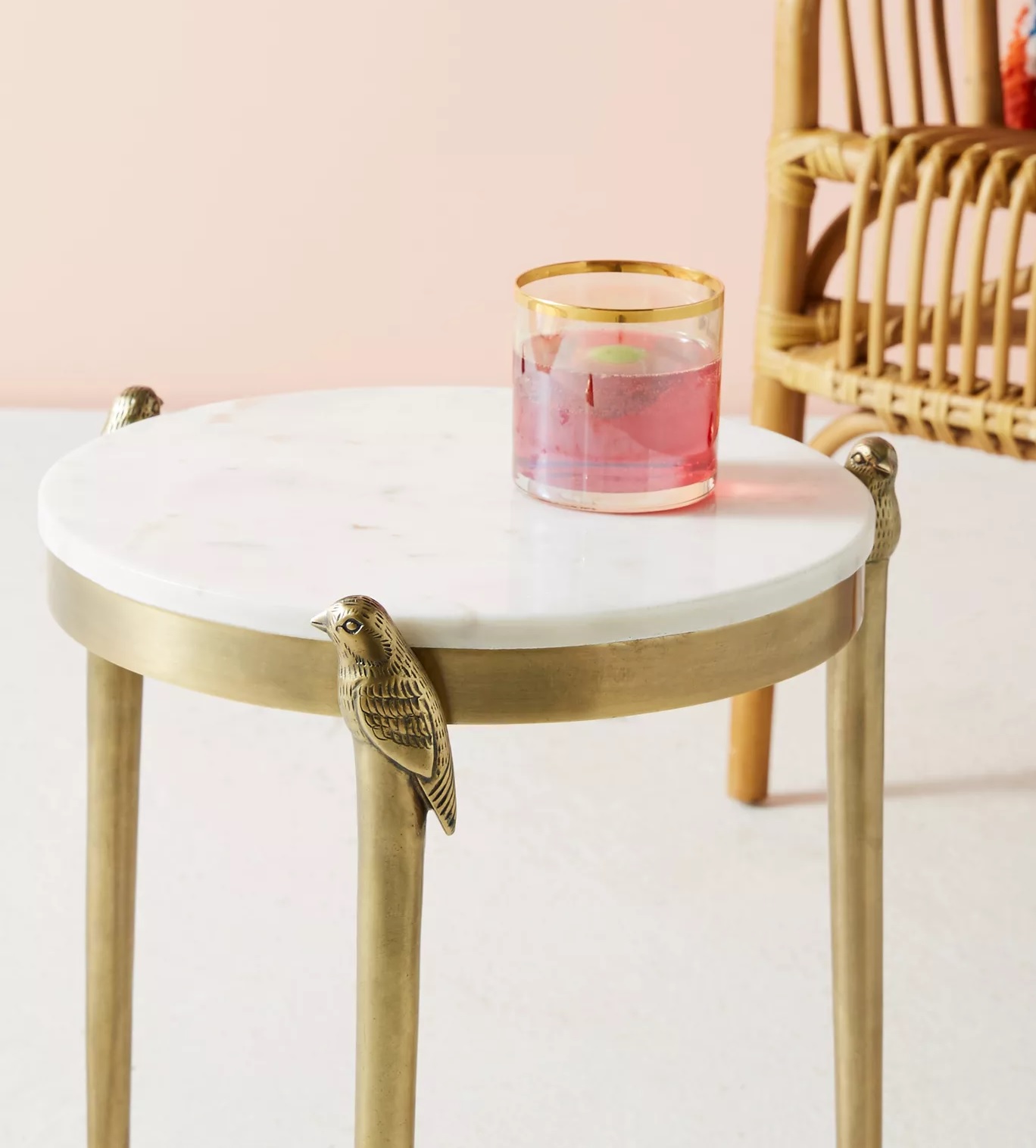 Brass end table with bird details