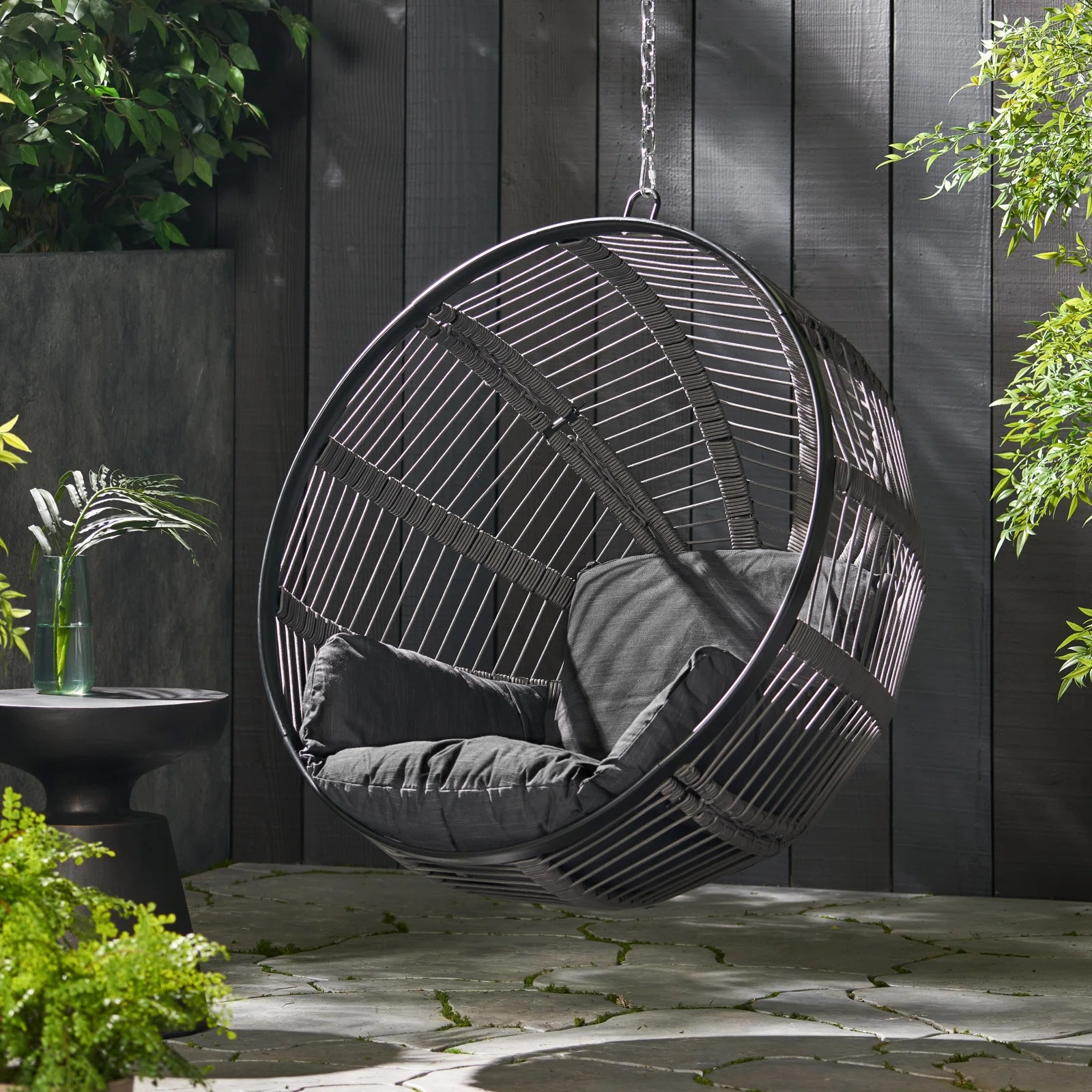 ball shaped hanging chair in backyard