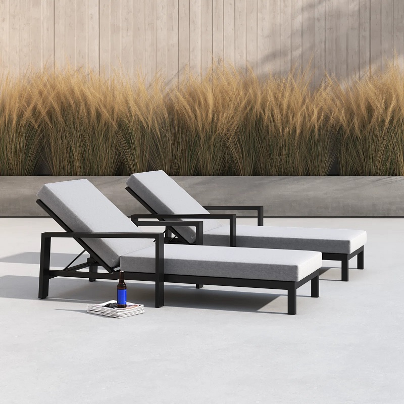 two black and grey metal outdoor lounge chairs