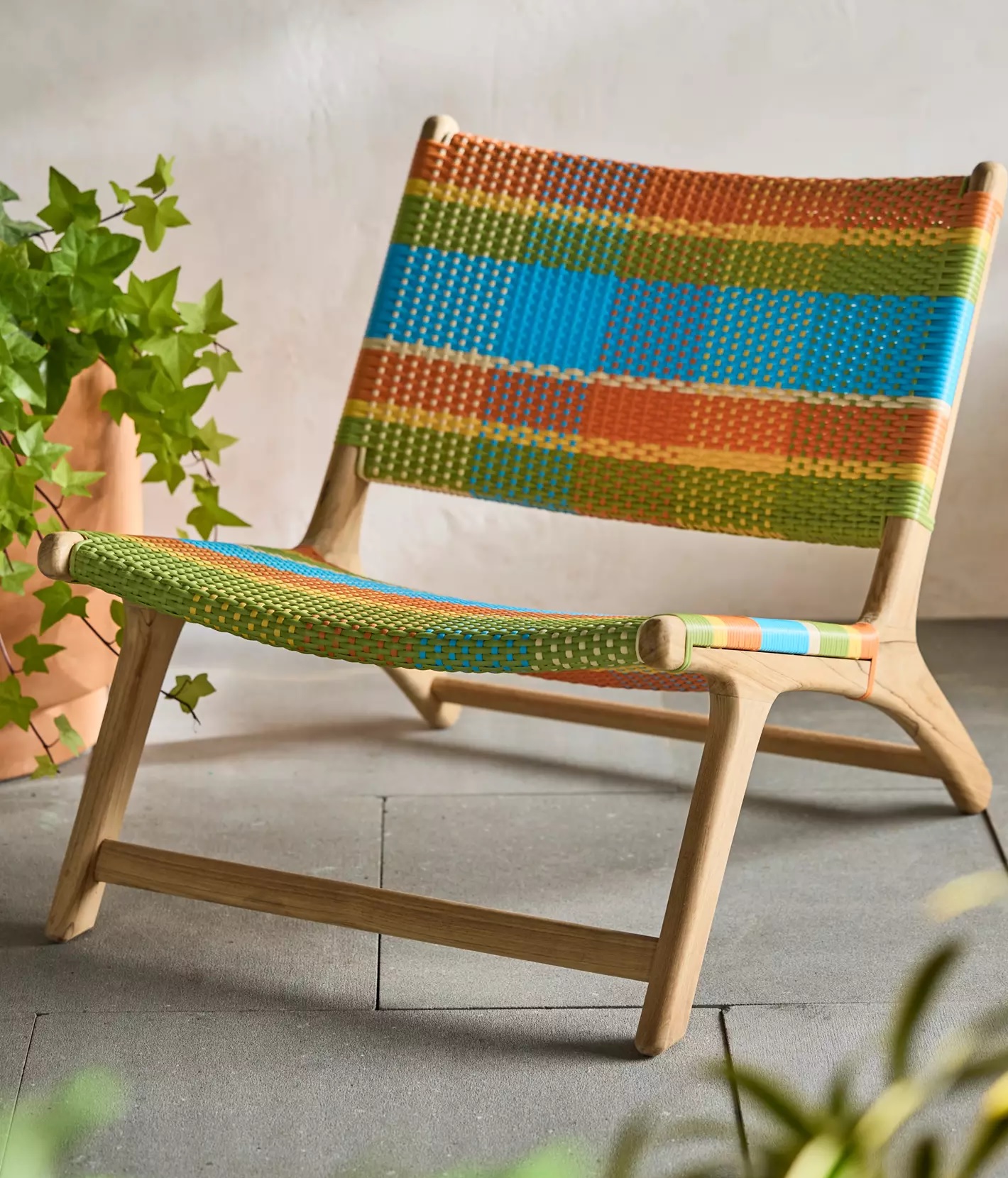 colorful plaid outdoor lounge chair with mid-century modern wood base