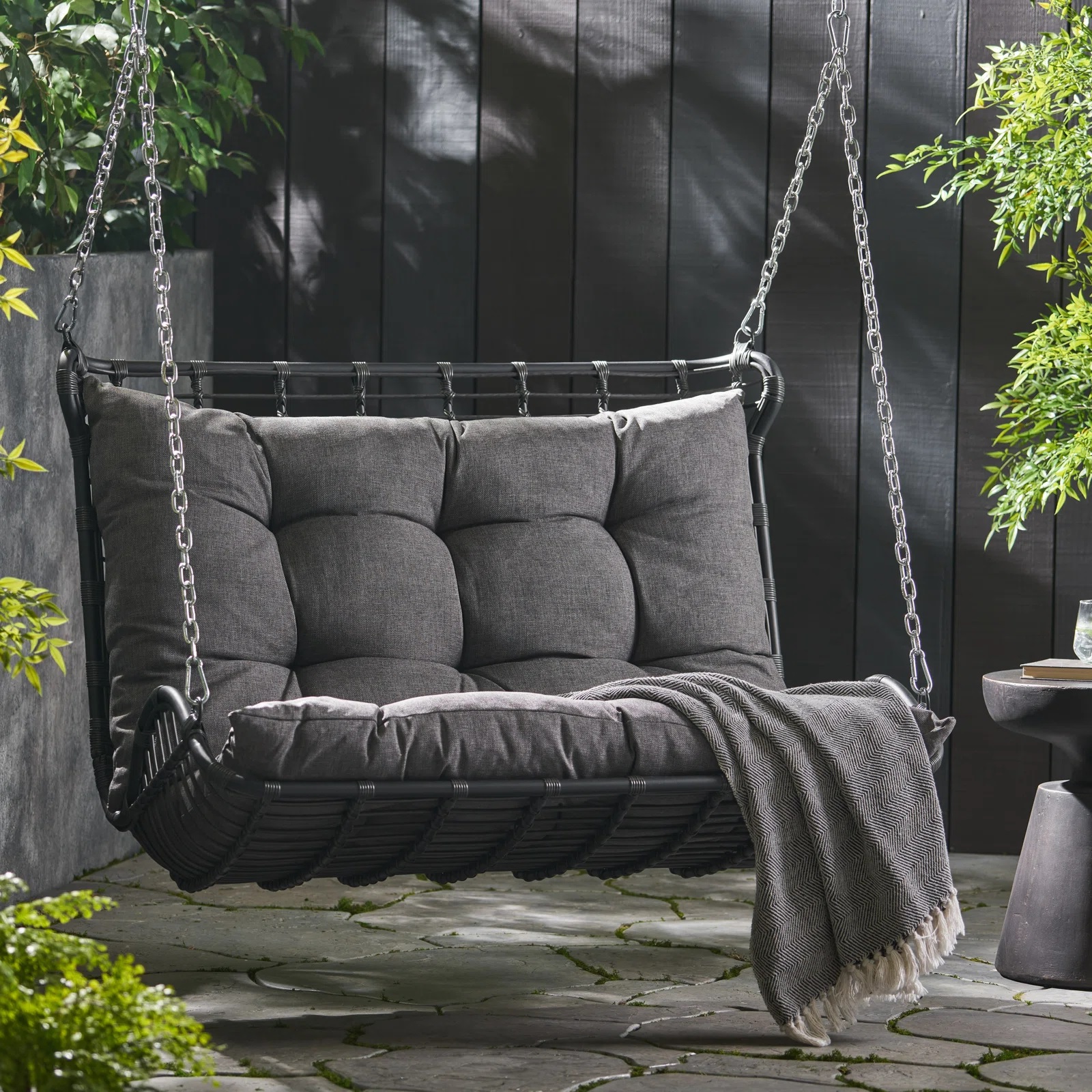 black outdoor swing chair with charcoal cushion