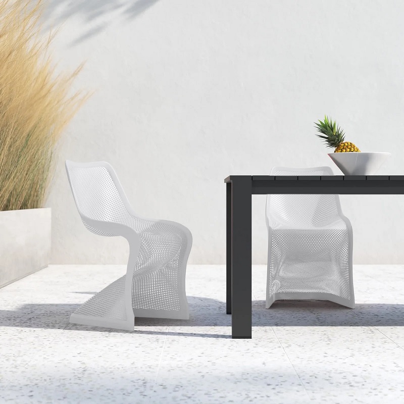 two white panton style chairs at outdoor dining table