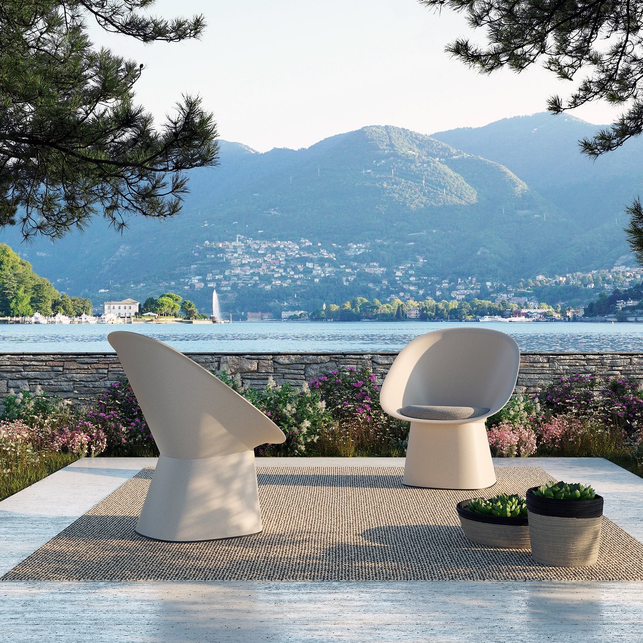 two white sculptural armchairs outdoors