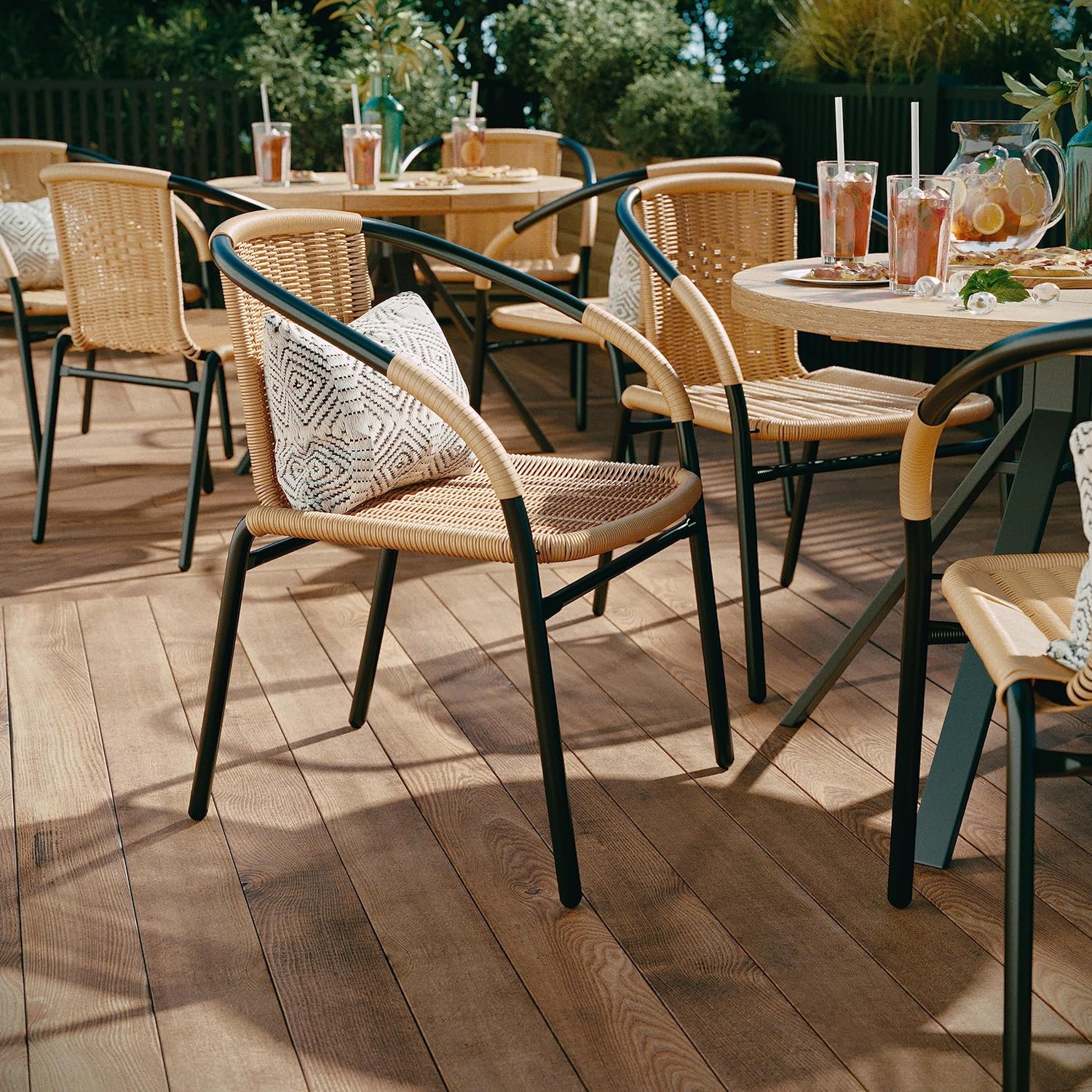 black outdoor dining chair with tan rattan details