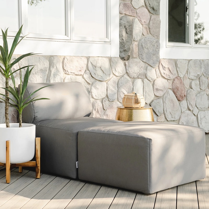 two piece minimalist lounge chair with beige upholstery on patio