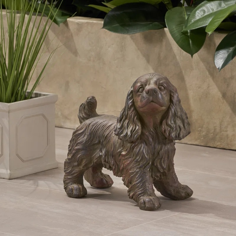 Bronze garden statue shaped like a Cocker spaniel