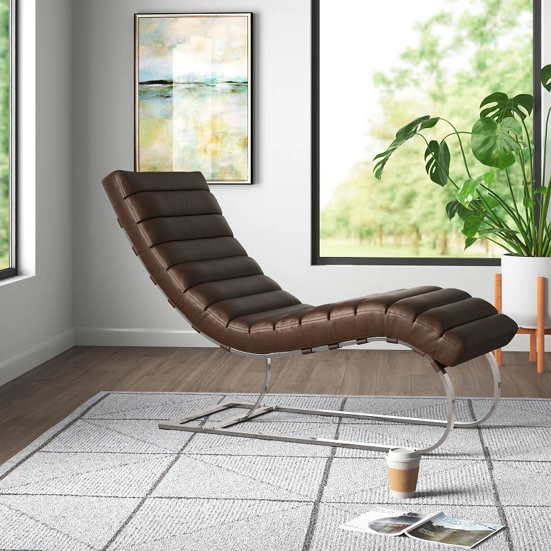 An s-shaped chaise with metal base