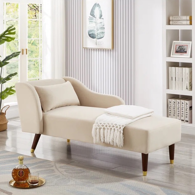 Cream chaise with brass-capped wood legs