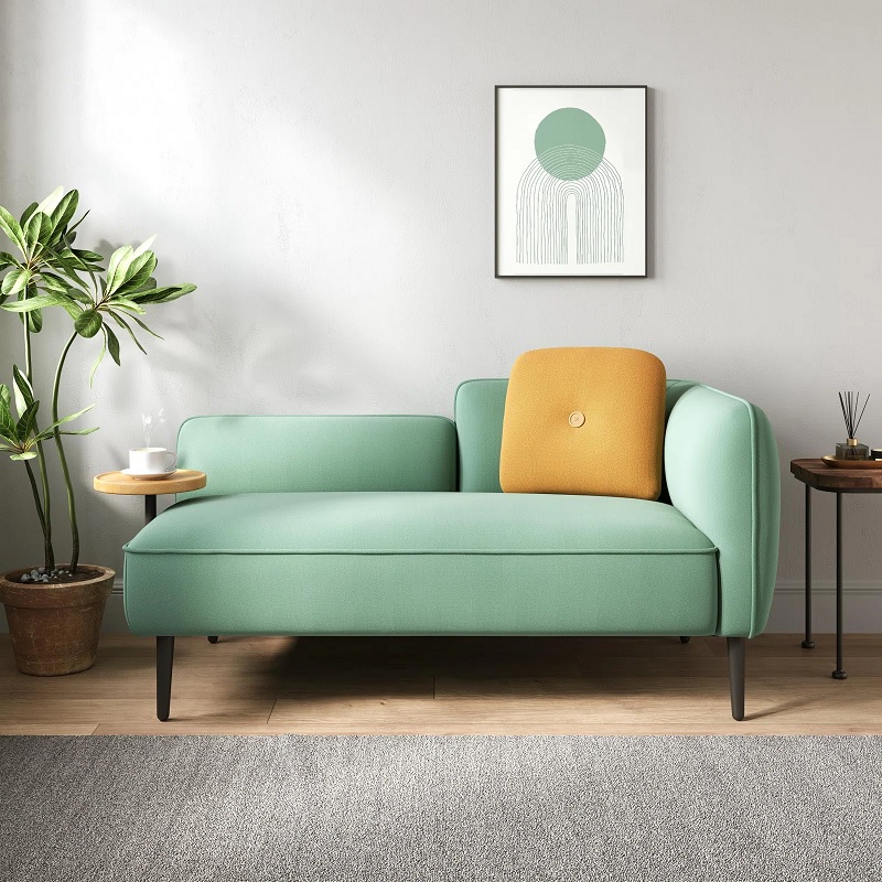 Teal chaise with yellow pillow