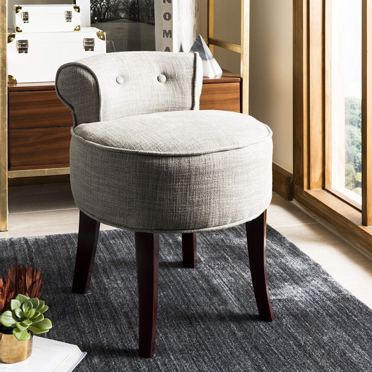 https://www.home-designing.com/wp-content/uploads/2019/08/grey-vanity-stool-chair-with-short-back-and-solid-wood-legs.jpg
