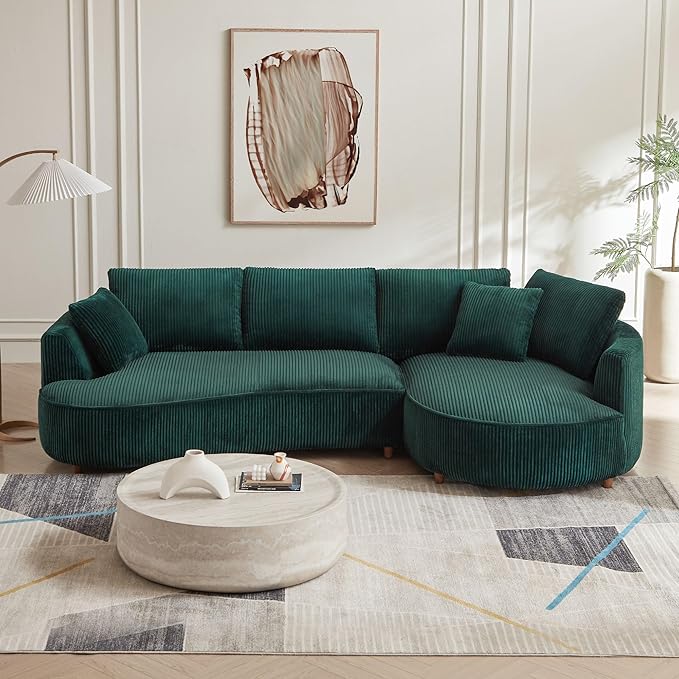 Emerald green upholstered curved sofa