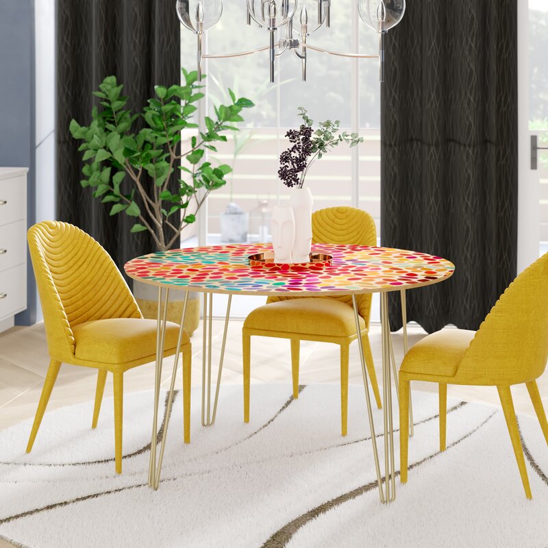 https://www.home-designing.com/wp-content/uploads/2020/06/Small-Colorful-Dining-Table-with-Hairpin-Legs-and-Yellow-Chairs-Mid-Century-Modern.jpg