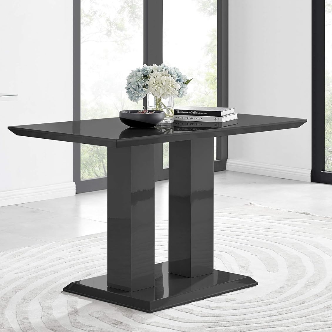 Glossy black dining table with double pedestal base