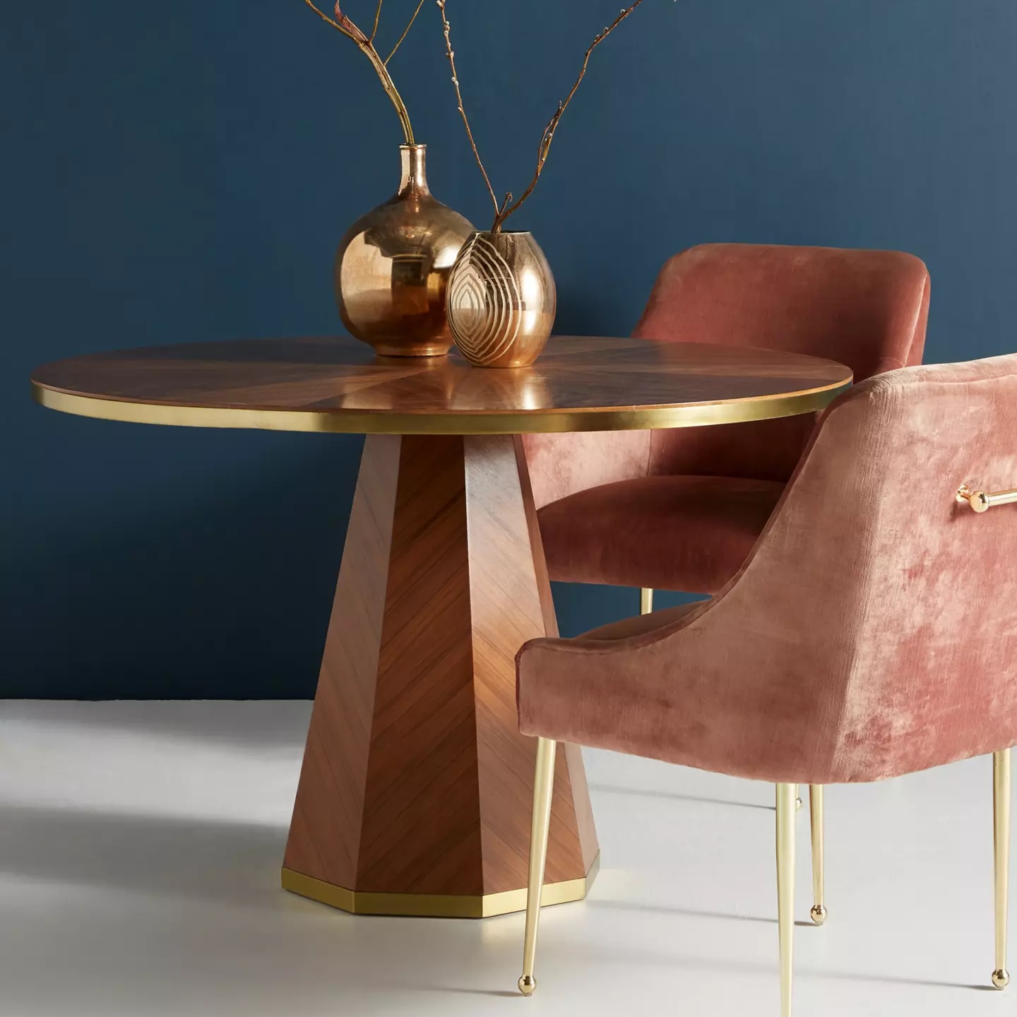 Small dining table with chevron marquetry and brass details