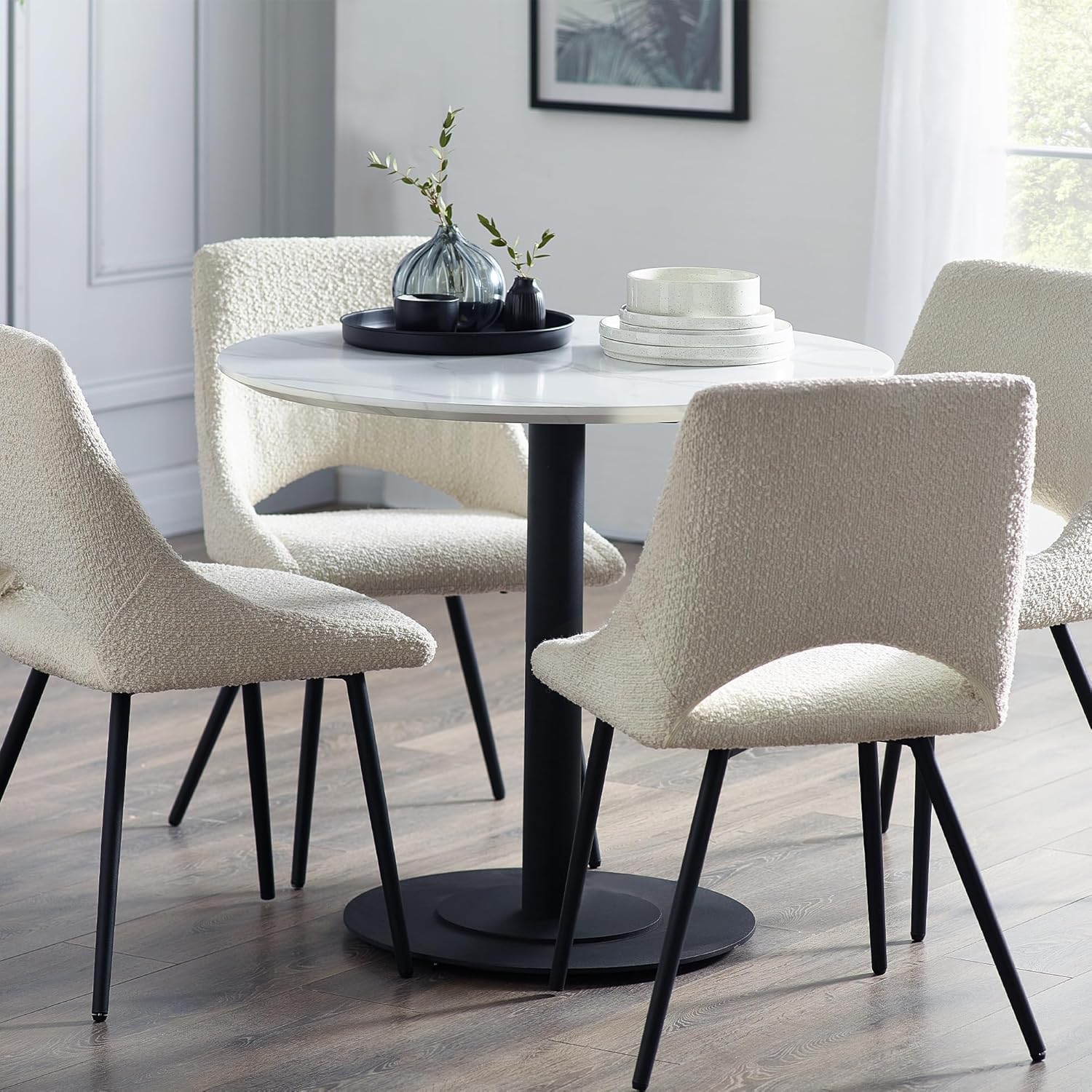 Small faux marble dining table with black pedestal base