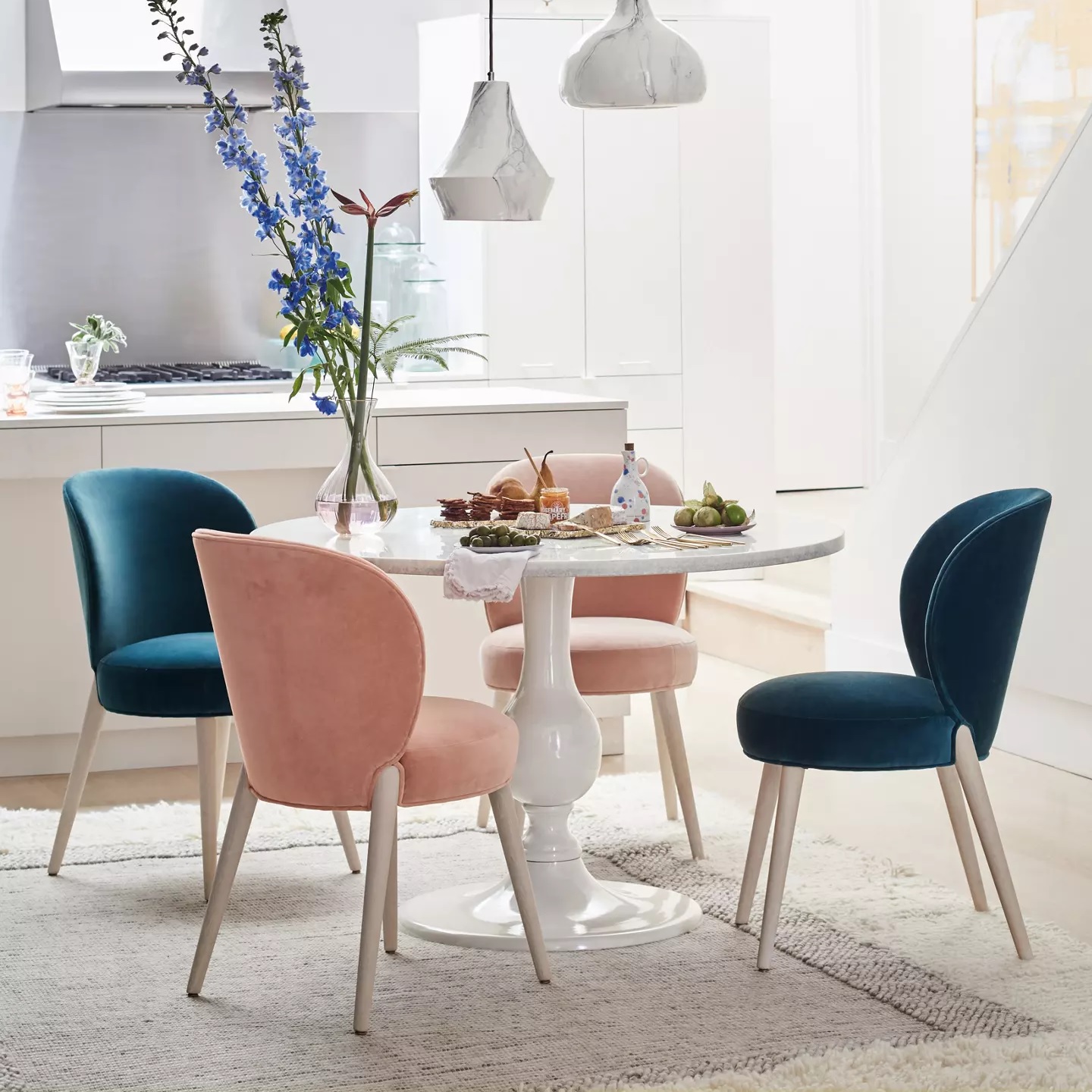 Small marble dining table with white pedestal base