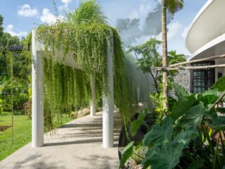 Lush Tropical House Surrounded By Nature