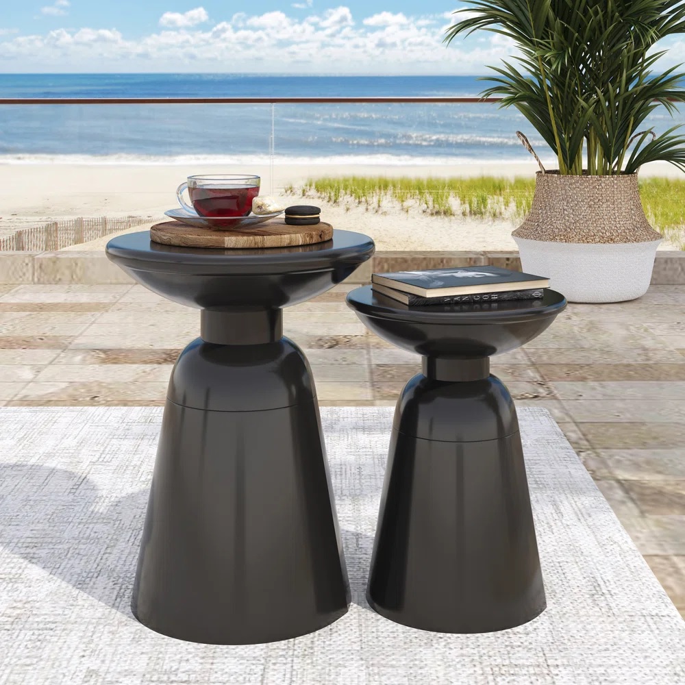 Two black side tables with glossy finish