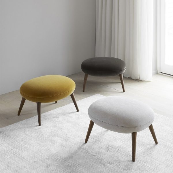 https://www.home-designing.com/wp-content/uploads/2021/06/cute-modern-footstool-for-sale-online-designer-living-room-accessories-rounded-cushion-top-tapered-wood-legs-multipurpose-high-end-furniture-for-sale-online-600x600.jpg