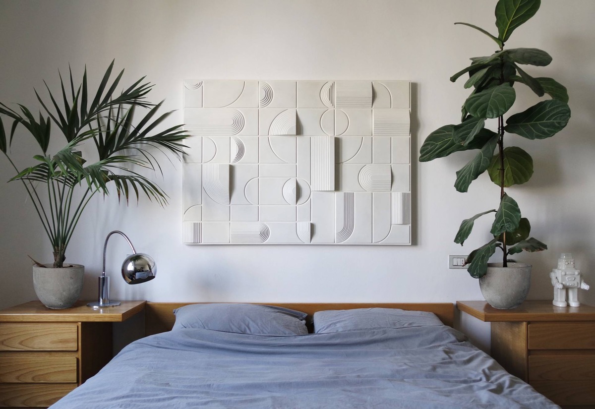 https://www.home-designing.com/wp-content/uploads/2021/09/luxury-bedroom-wall-art-decor-limited-run-exclusive-italian-spatialism-paul-bik-geometric-monochromatic-modern-art-to-hang-above-bed.jpg