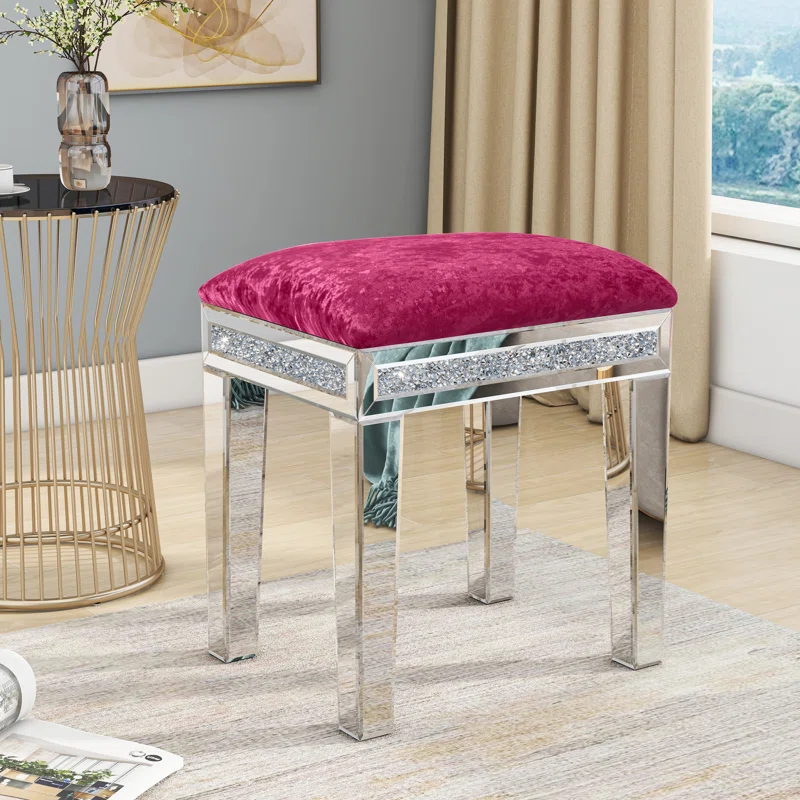 Pink entryway stool with mirrored exterior