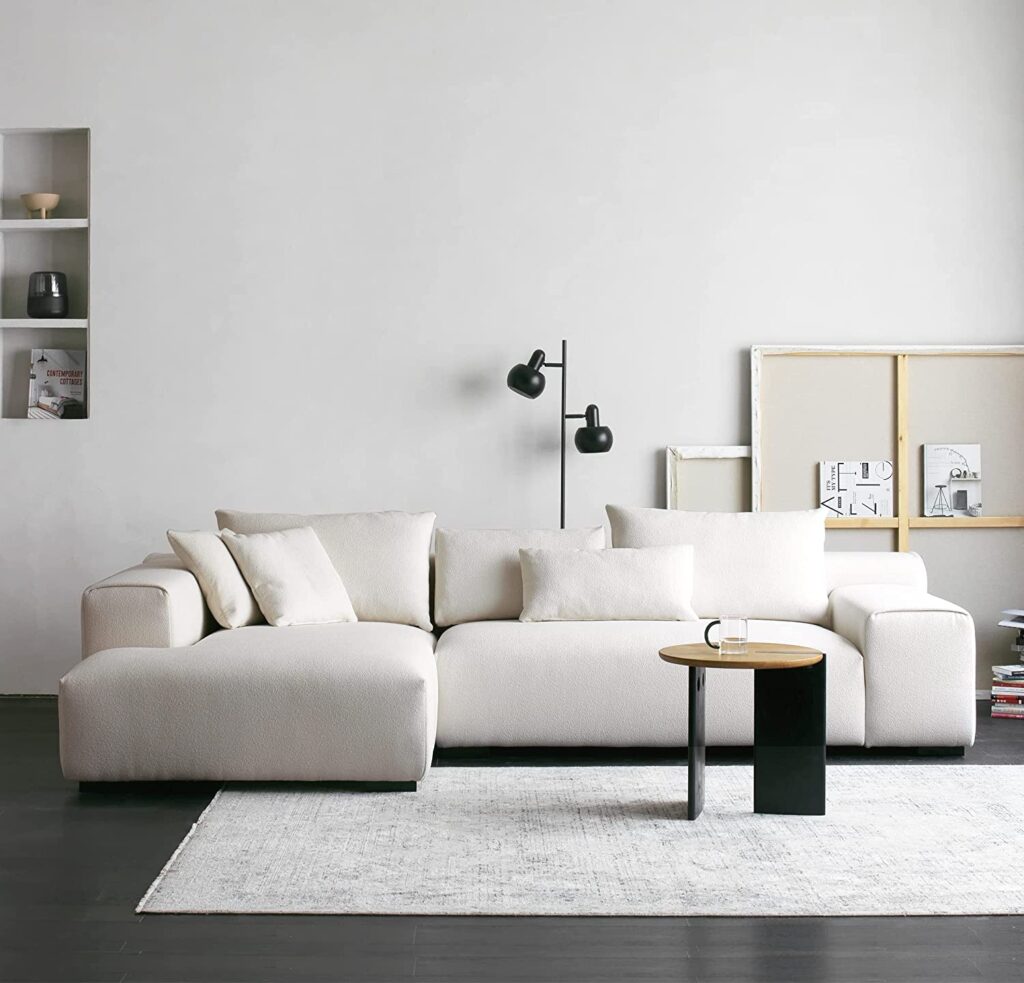 oversized white sectional sofa with pillowy overstuffed cushions and ...