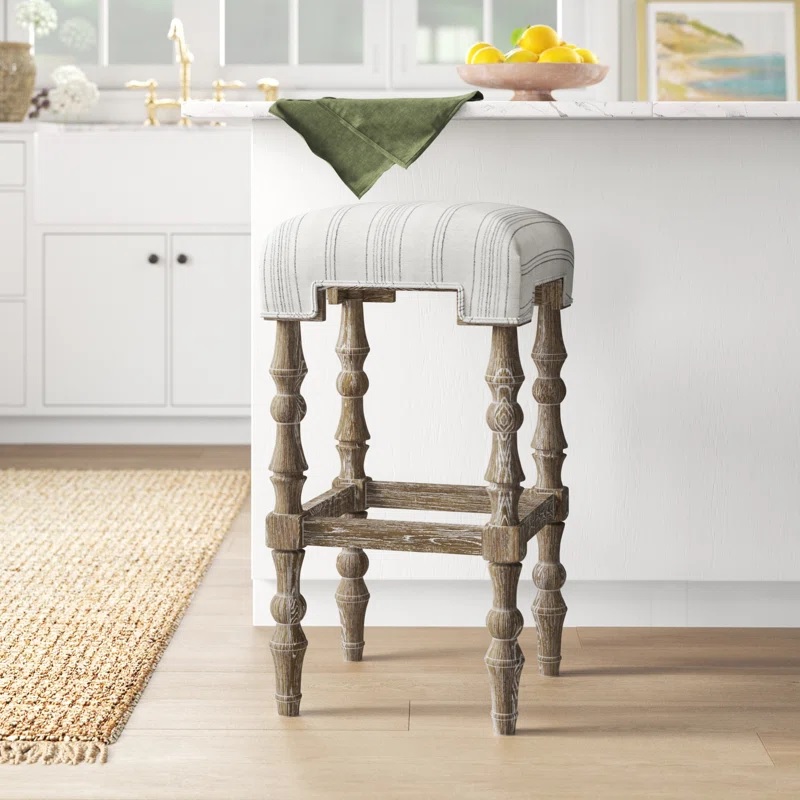 artisanal modern farmhouse upholstered bar stool with pinstripe farmer fabric and turned legs rustic weathered whitewash finish cute rustic seating for counter height dining