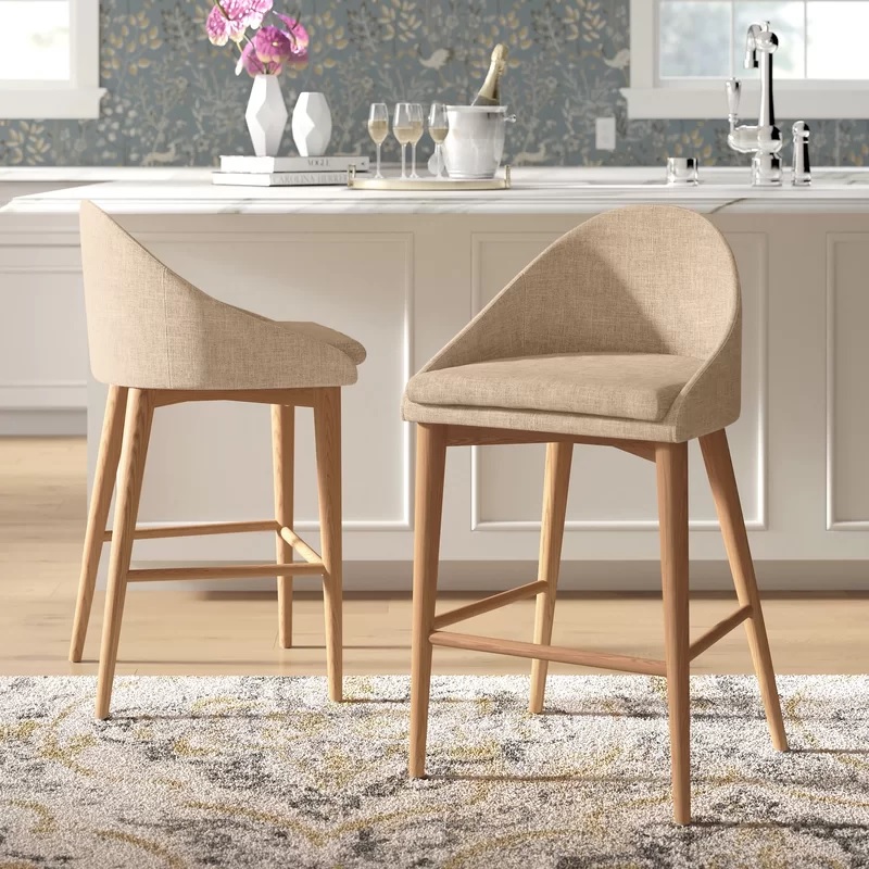 low back upholstered bar stool with curved backrest and wooden base built in footrest comfortable versatile seating ideas for dine in kitchen counter height seating