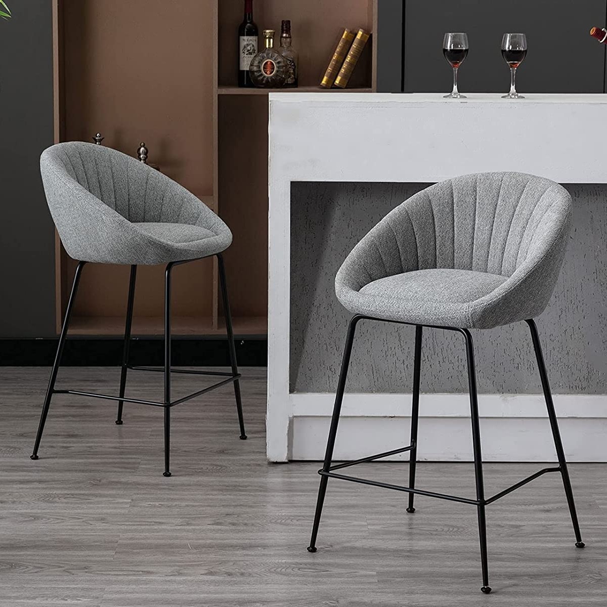 modern upholstered bar stools with curved backrest and decorative tufting slender metal legs with black finish and built in footrest contemporary eat in kitchen furniture