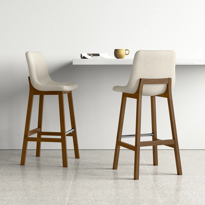 modern wooden bar stool with neutral brown base four legs metal footrest ivory upholstered seat with backrest curved molded form comfortable counter height seating for kitchen