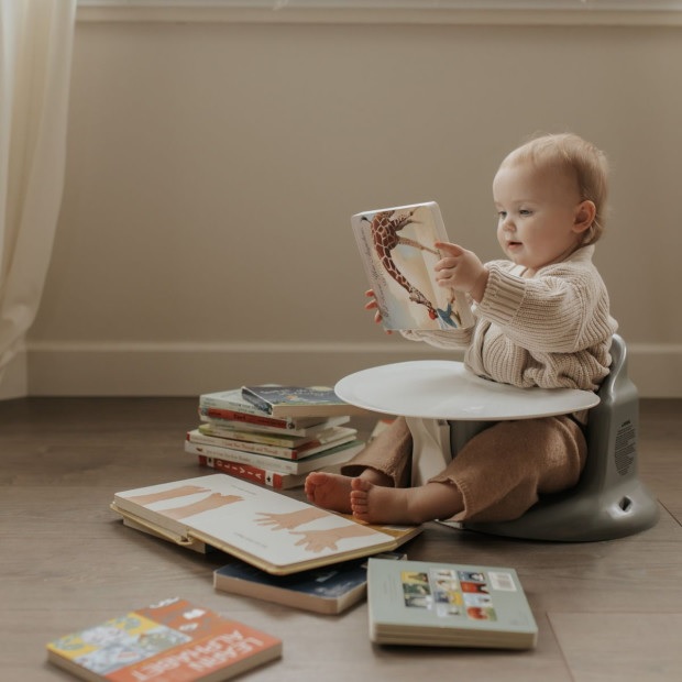 Upseat baby floor chair with removable activity tray plastic booster seats for babies ergonomic infant seating for the floor safety buckle and side ties grey and white