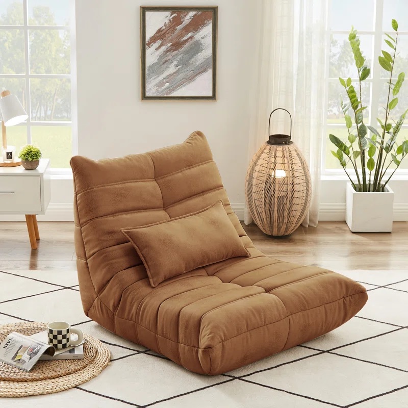 brown upholstered floor chair with deep tufting and included lumbar pillow comfortable floor level seating ideas for adults casual lounge furniture for bohemian chic decor theme