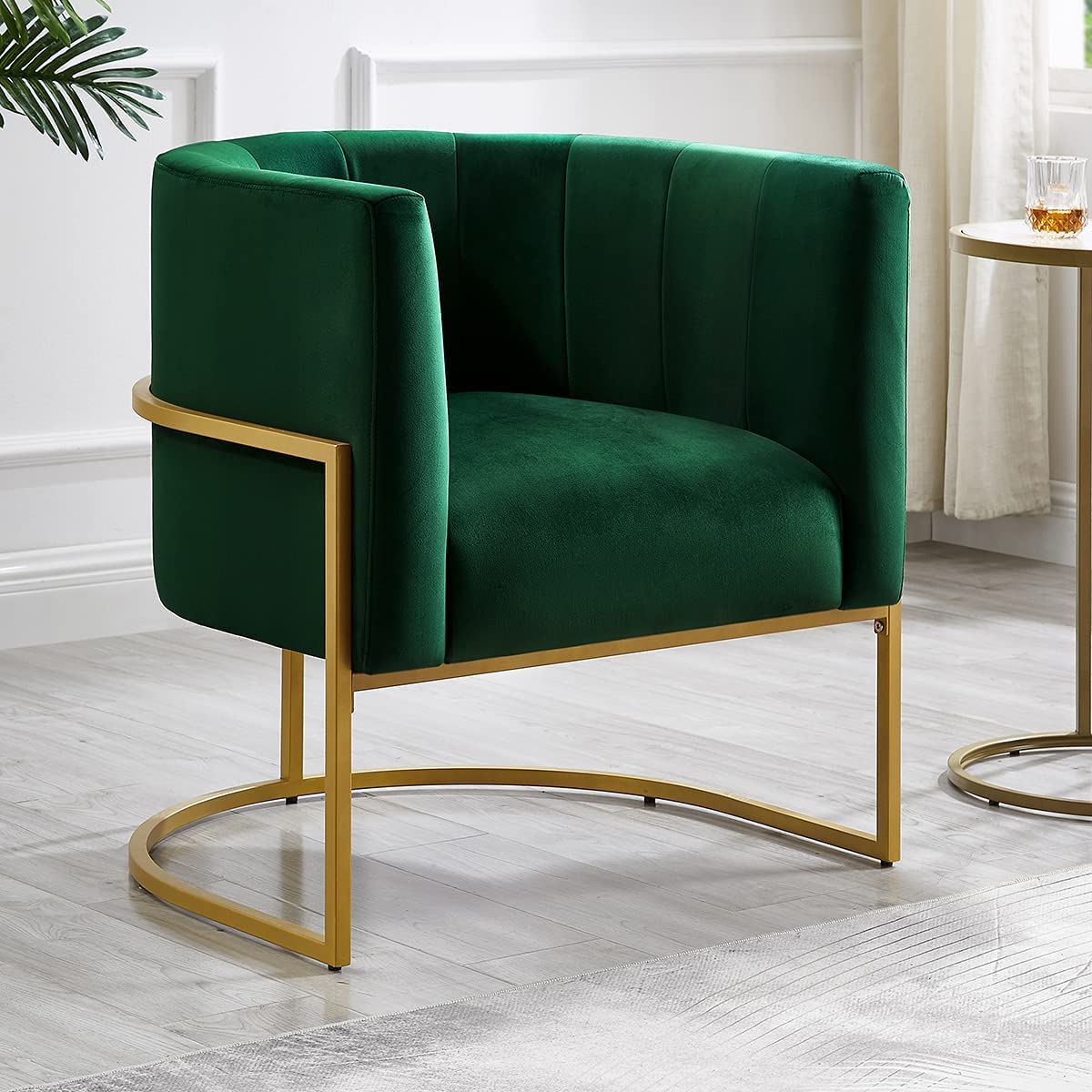 green and gold accent chair with barrel back and soft velvet upholstery rounded backrest with tufted interior tight cushioned seat stylish chairs for formal living rooms entry