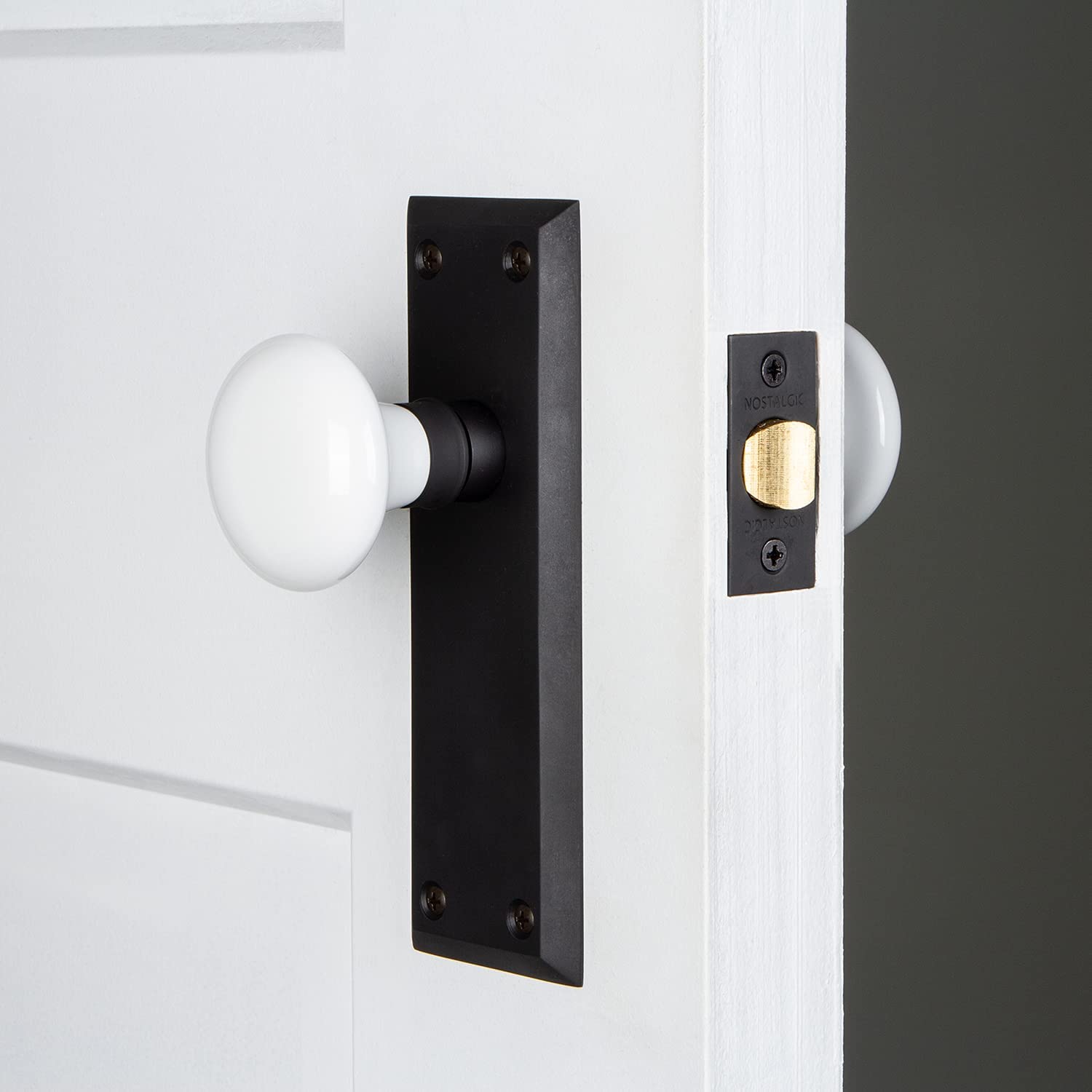 traditional bronze door knobs with white porcelain doorknob and tall black backplate attractive stylish classic doorknobs for period correct homes beveled plate