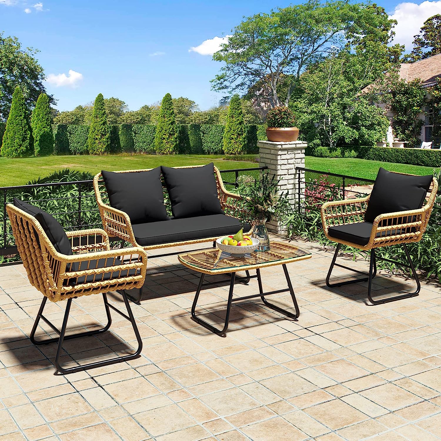 black and rattan outdoor wicker patio furniture set with deck loveseat two armchairs and a glass topped coffee table for poolside conversation area decor inspiration