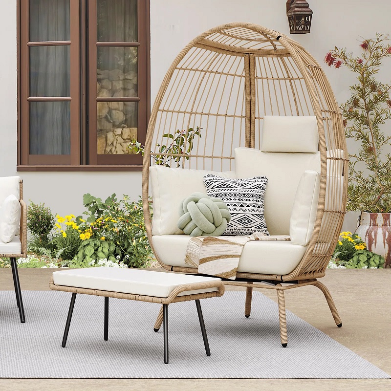 egg shaped comfy patio chair with wicker cage exterior and plush cushioning tall backrest with headrest and side cushions unique outdoor reading nook weather resistant