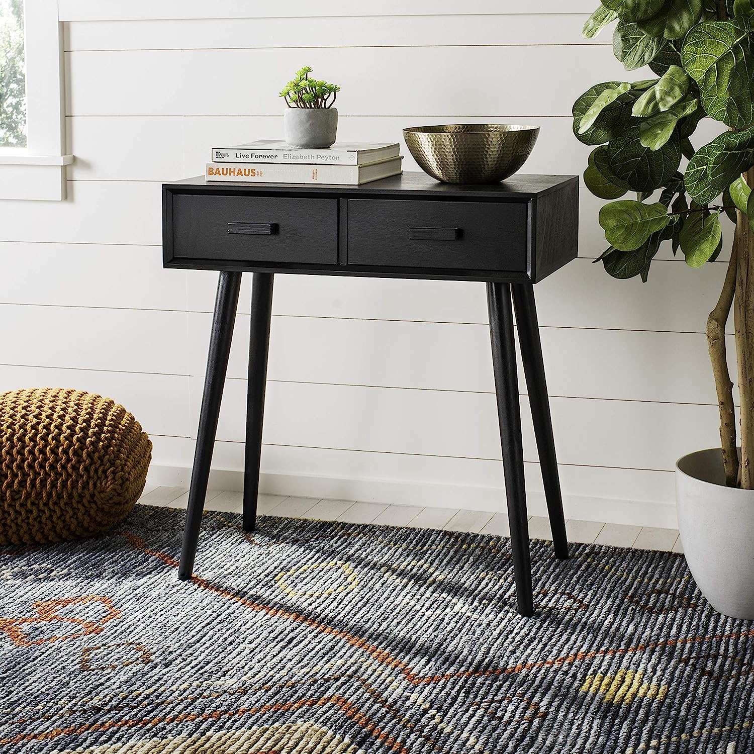 narrow black console table with mid century modern silhouette and two storage drawers cute table ideas for the end of a hallway storage ideas for entryway small space