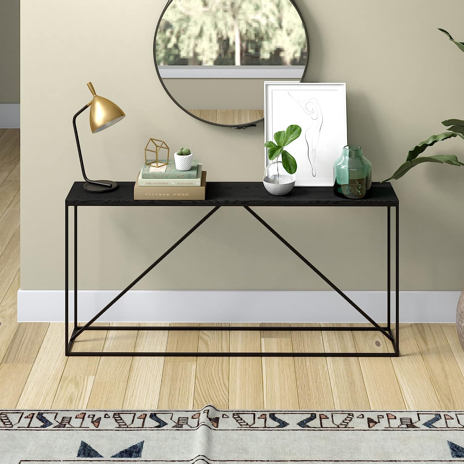 slim black console table with metal base and thin black tabletop architectural furniture inspiration for industrial minimalist interior decor theme ideas hallway tables