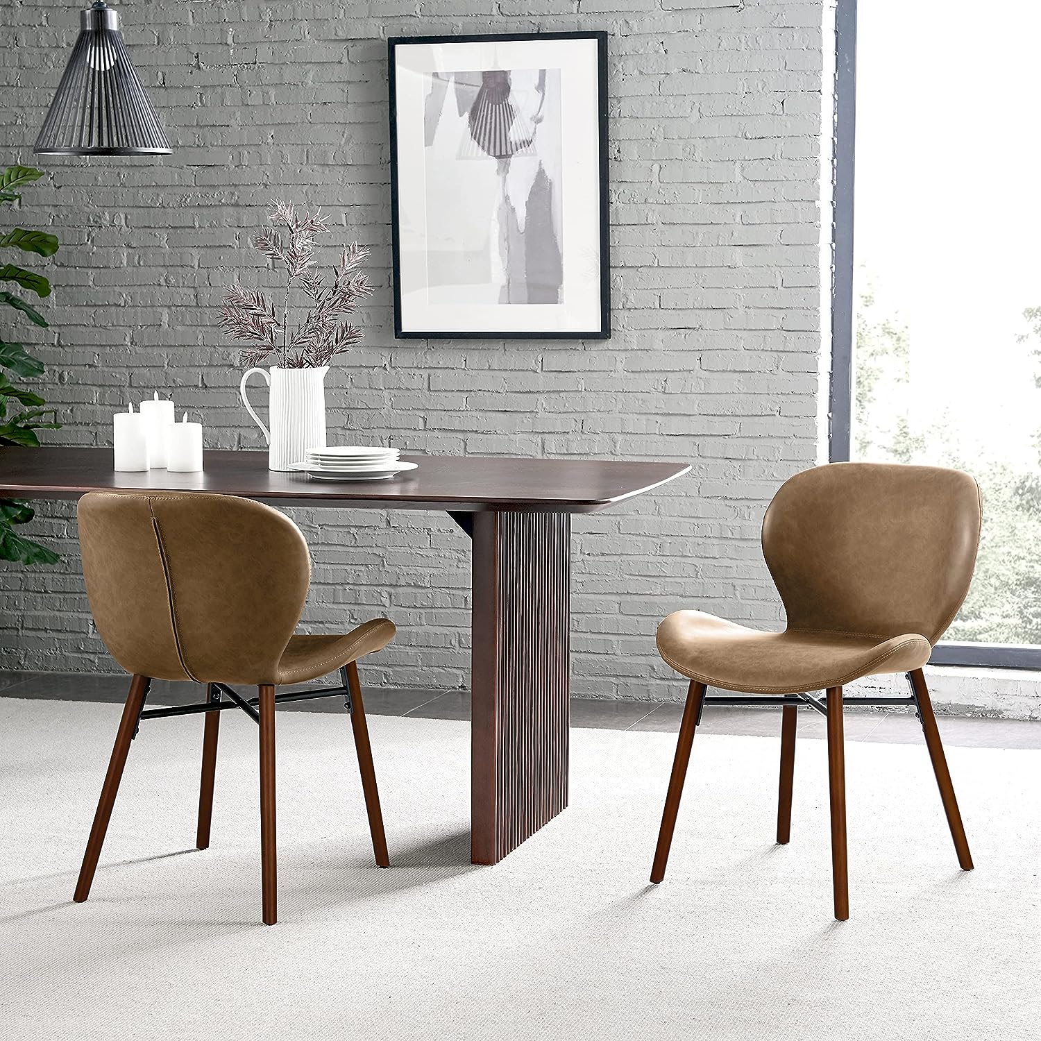 medium brown leather dining chairs with curved backrest and seat mid century modern silhouette tapered wooden legs dining chairs with matching stools