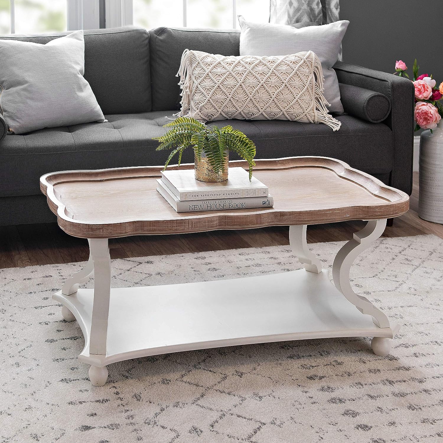 scalloped tray top rustic farmhouse coffee table with distressed whitewash finish and open lower shelf unique sculptural legs charming cottage chic living room furniture for sale